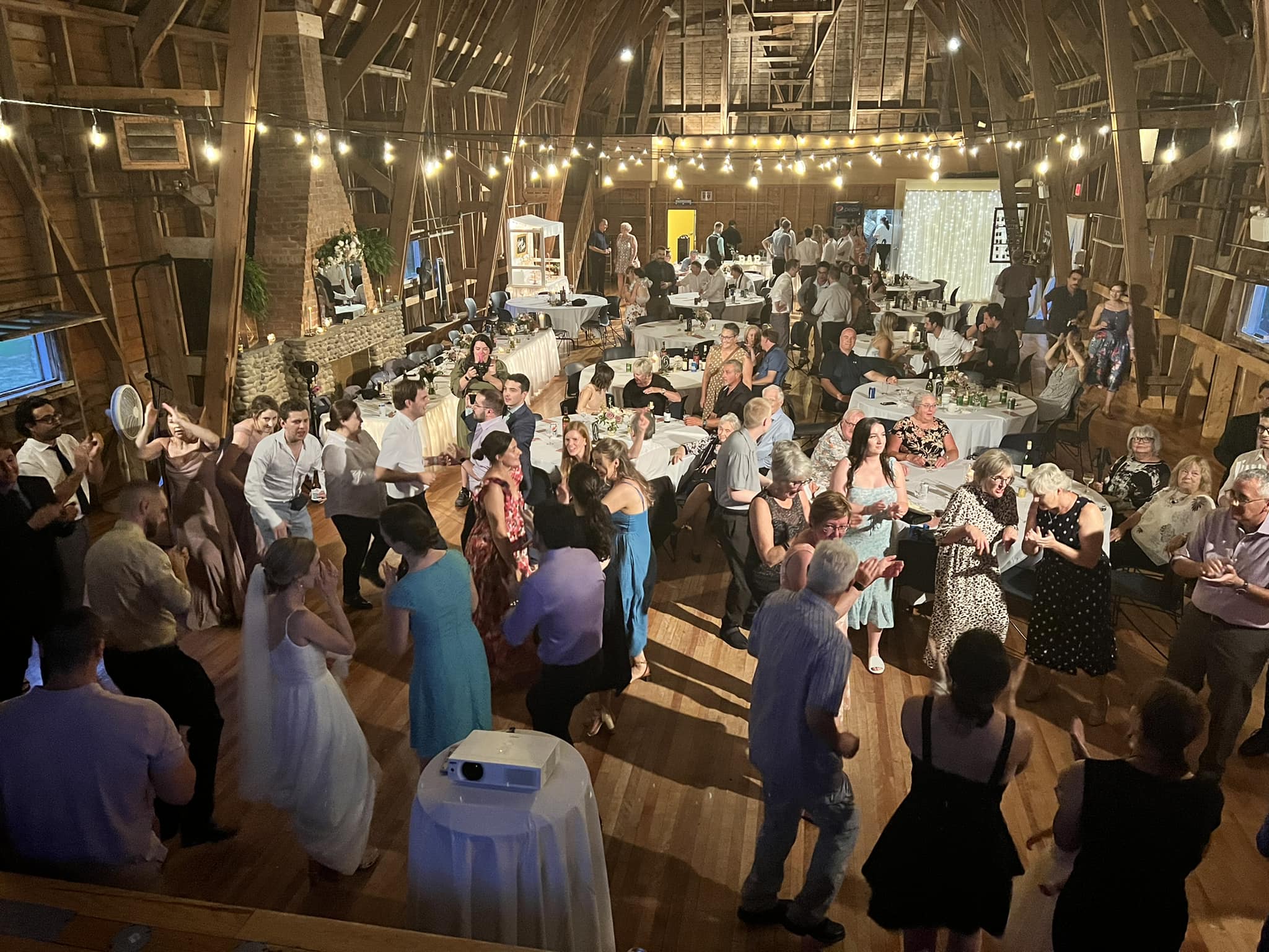 Rustic barn wedding reception with a full dance floor